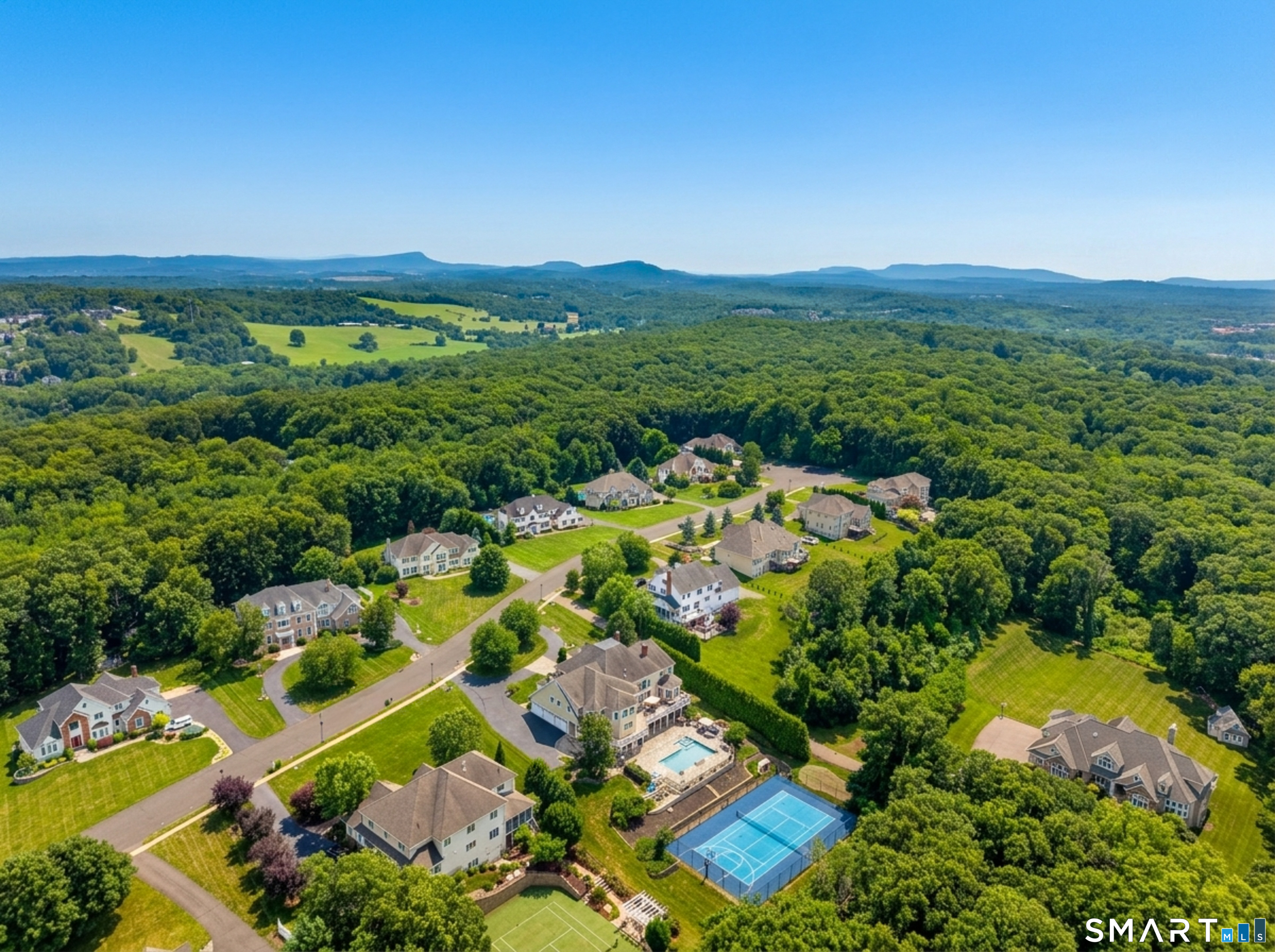 55 Hunters Ridge Rocky Hill, CT 06067 - Photo 3 of 40 a view of a lush green hillside and houses