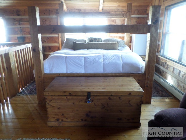 1918 Replogle Drive Boone, NC 28607 - Photo 13 of 39 a bed sitting in a bedroom next to a window