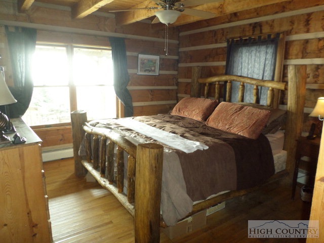 1918 Replogle Drive Boone, NC 28607 - Photo 35 of 39 a bedroom with a bed and a window