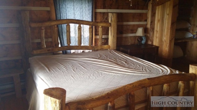 1918 Replogle Drive Boone, NC 28607 - Photo 10 of 39 a bedroom with a bed and a window