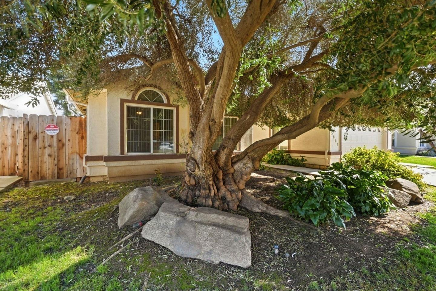 3882 Pintail Court Merced, CA 95340 - Photo 2 of 21 a view of a house with a yard