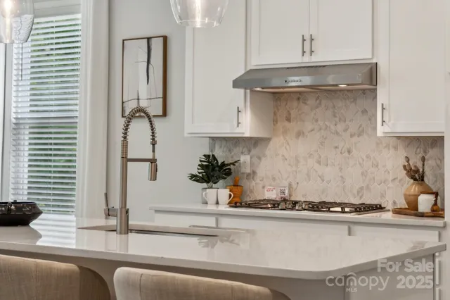 a bathroom with double sink and a mirror