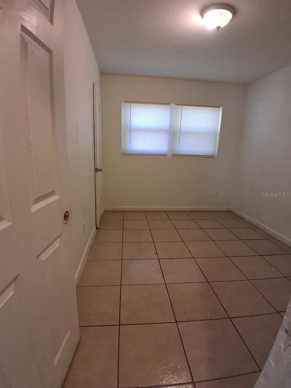 4115 Columbia Street Orlando, FL 32811 - Photo 11 of 16 a view of an empty room and window