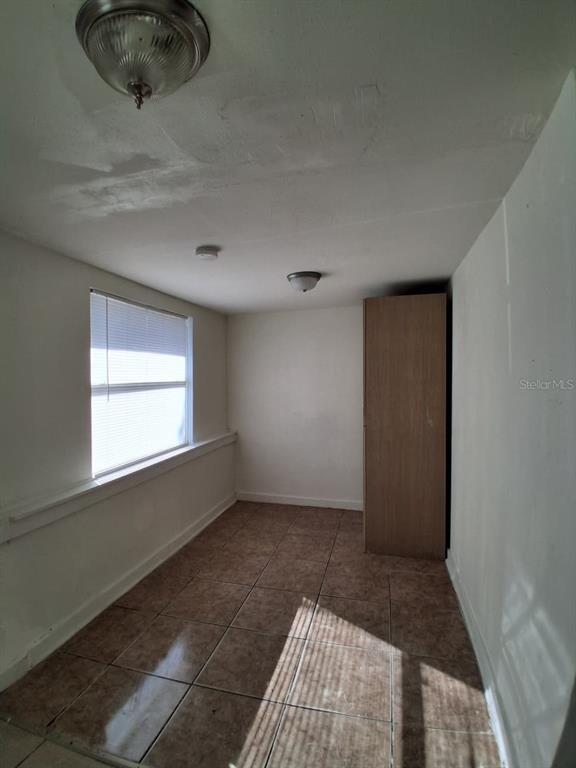 4115 Columbia Street Orlando, FL 32811 - Photo 15 of 16 a view of an empty room and window