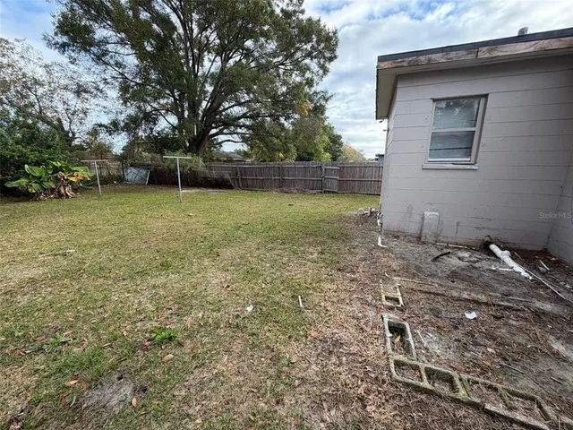a backyard of a house with lots of green space