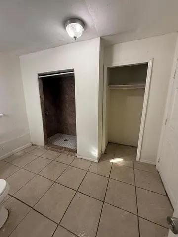 a view of a utility room and empty room