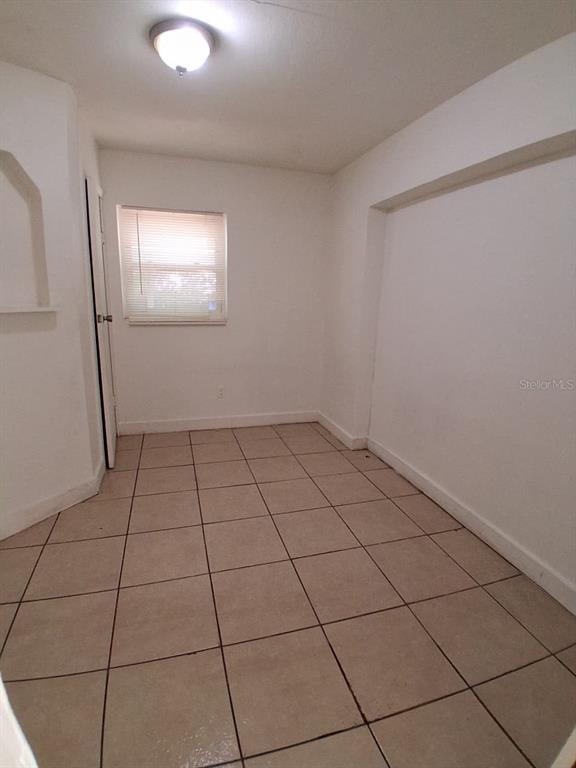 4115 Columbia Street Orlando, FL 32811 - Photo 10 of 16 a view of an empty room and window