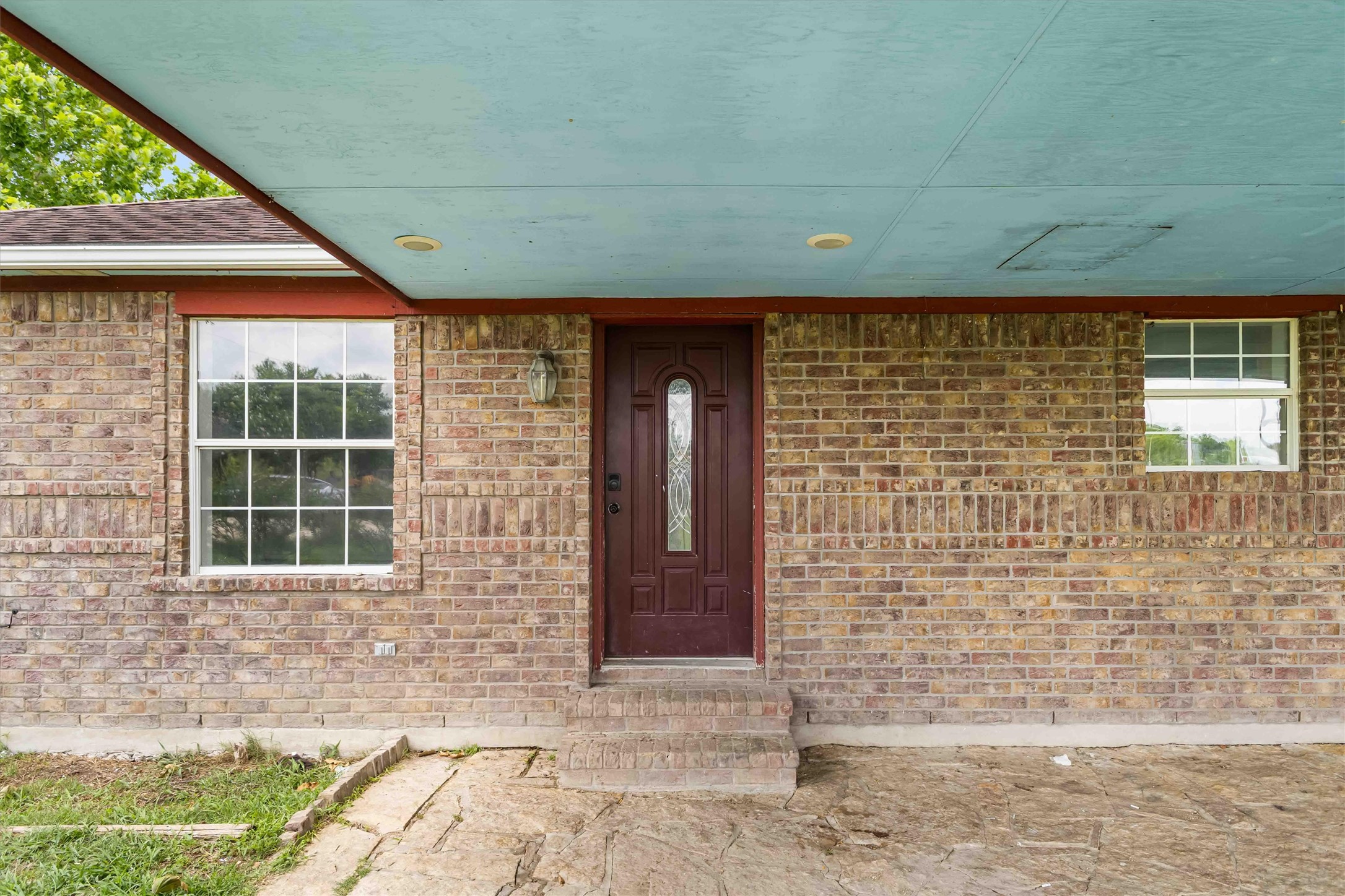 12212 Ballerstedt Road Elgin, TX 78621 - Photo 5 of 39 Property entrance featuring brick siding and covered porch