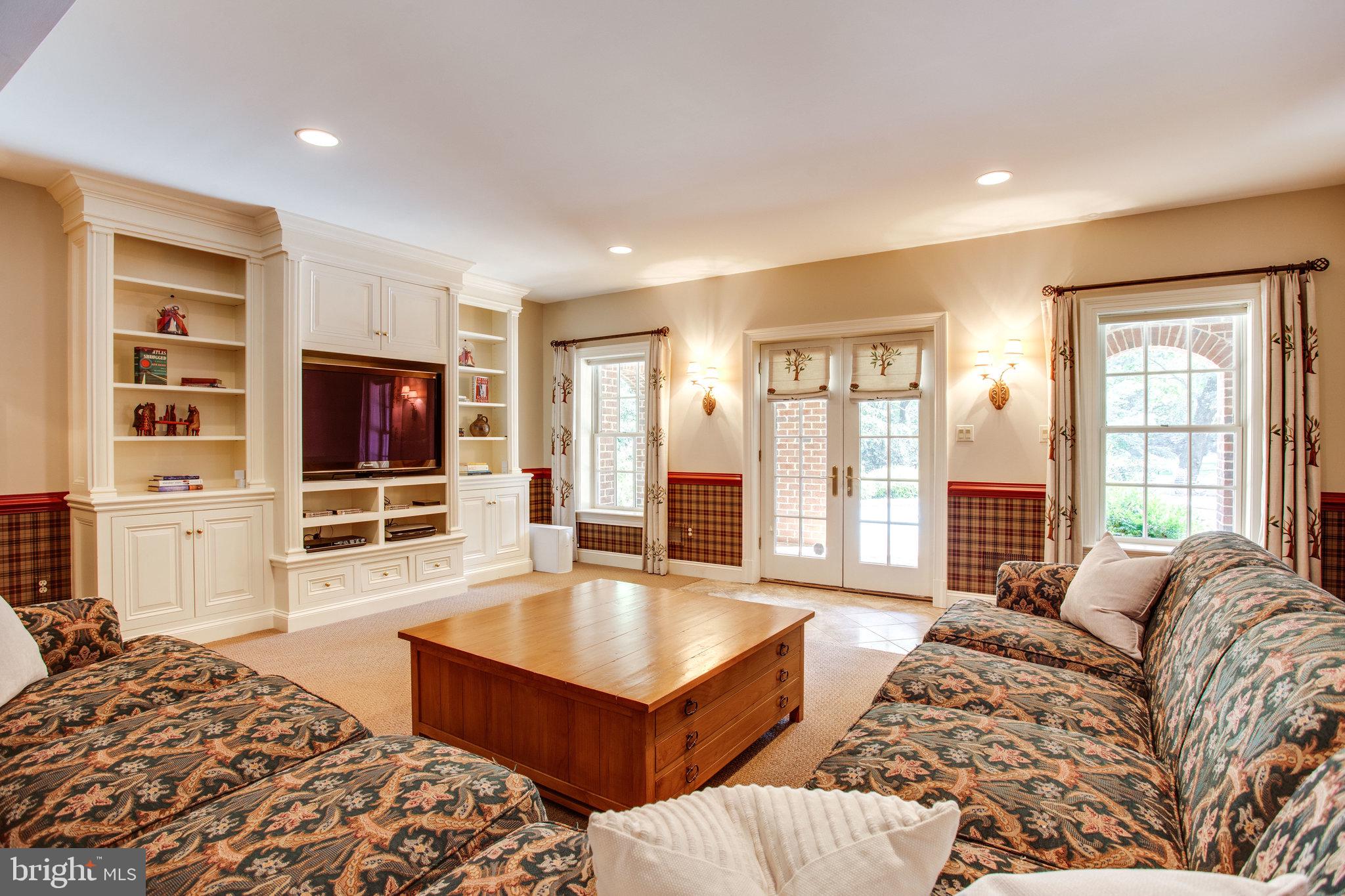 1008 Pine Hill Road McLean, VA 22101 - Photo 20 of 29 a living room with furniture and a flat screen tv