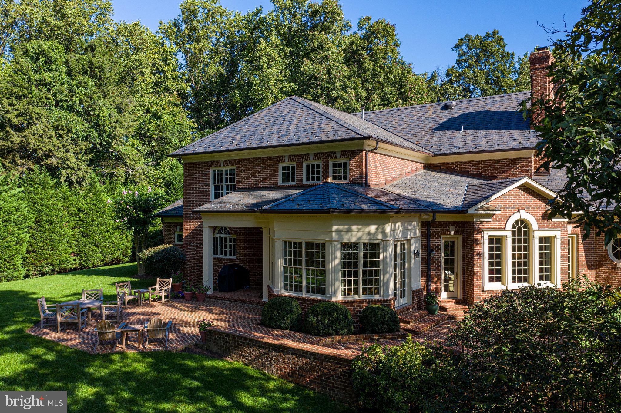 1008 Pine Hill Road McLean, VA 22101 - Photo 25 of 29 a view of a brick house with a large windows and a large tree