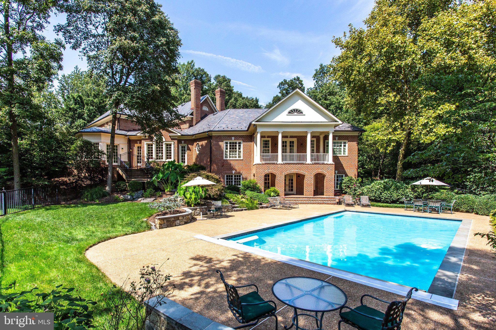 1008 Pine Hill Road McLean, VA 22101 - Photo 6 of 29 a view of a house with swimming pool and a chairs