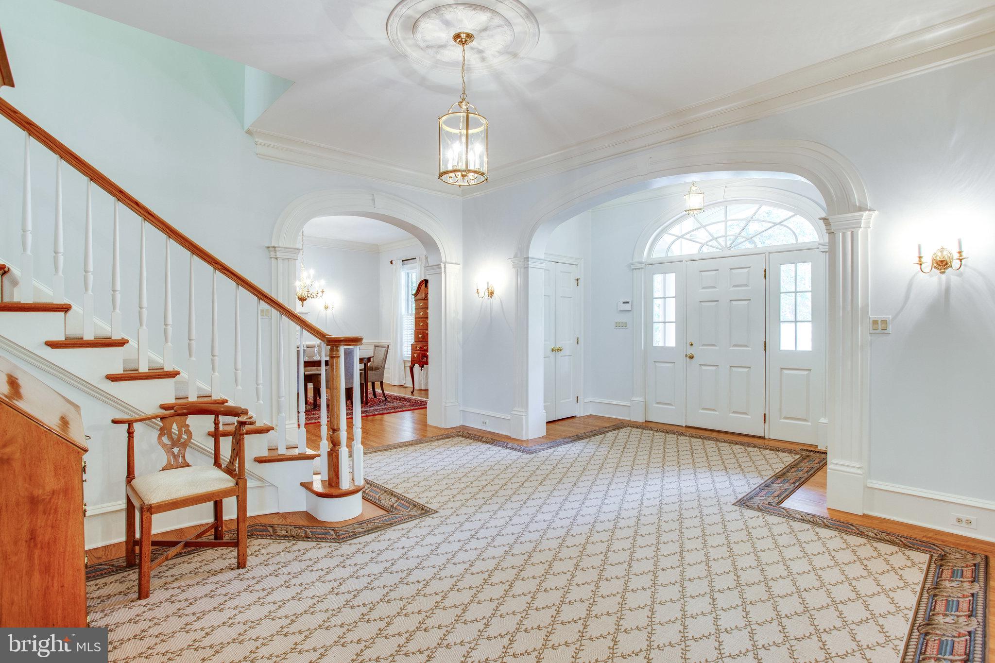 1008 Pine Hill Road McLean, VA 22101 - Photo 8 of 29 a view of entryway with wooden floor and a chandelier