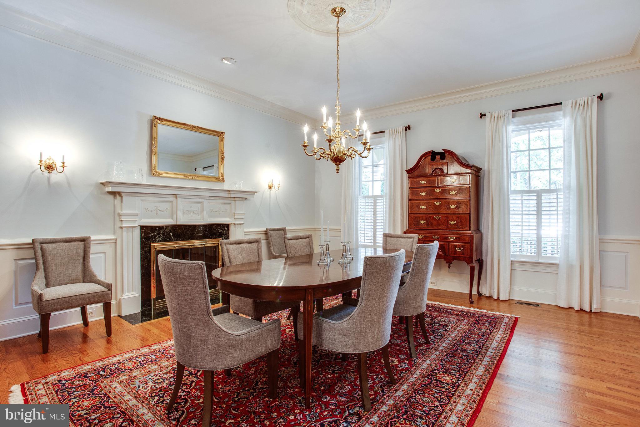 1008 Pine Hill Road McLean, VA 22101 - Photo 9 of 29 a dining room with furniture a chandelier and wooden floor