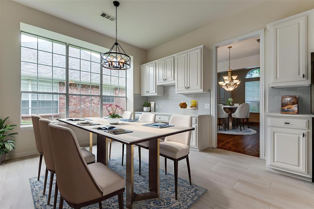 3313 Shady Valley Road Plano, TX 75025 - Photo 17 of 34 a kitchen that has a table and chairs in it