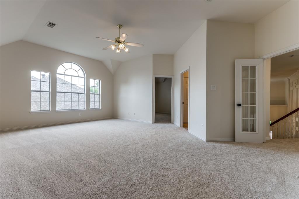 3313 Shady Valley Road Plano, TX 75025 - Photo 20 of 34 a view of a big room with windows and chandelier fan
