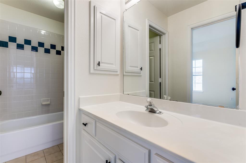 3313 Shady Valley Road Plano, TX 75025 - Photo 24 of 34 a bathroom with a tub sink and mirror