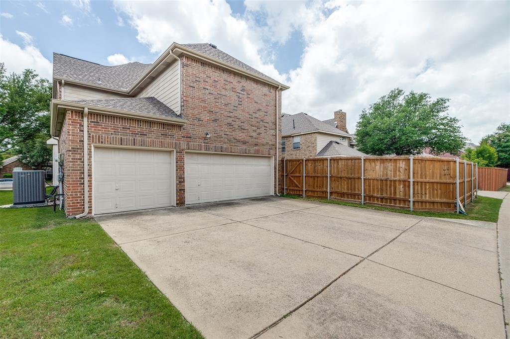 3313 Shady Valley Road Plano, TX 75025 - Photo 29 of 34 a view of a house with a yard and garage