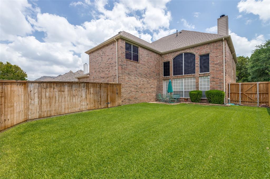 3313 Shady Valley Road Plano, TX 75025 - Photo 30 of 34 a front view of a house with a yard