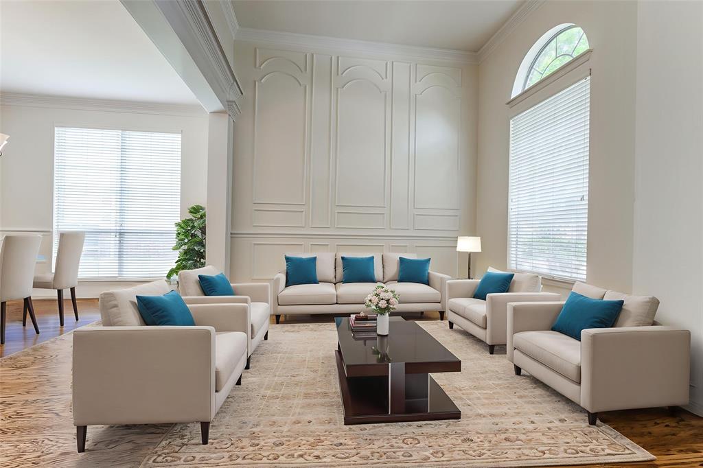 3313 Shady Valley Road Plano, TX 75025 - Photo 5 of 34 a living room with furniture wooden floor and a large window