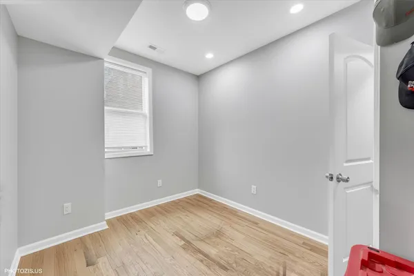a view of room with window and hardwood floor
