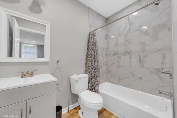a bathroom with a sink toilet and bathtub
