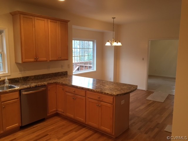 19731 Lacy Farm Road Moseley, VA 23120 - Photo 8 of 20 a kitchen with a sink cabinets and wooden floor