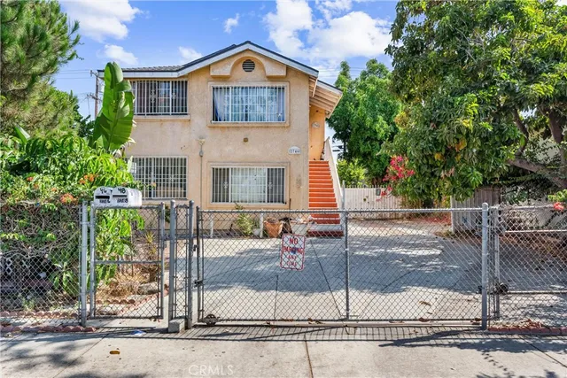a front view of a house with garage