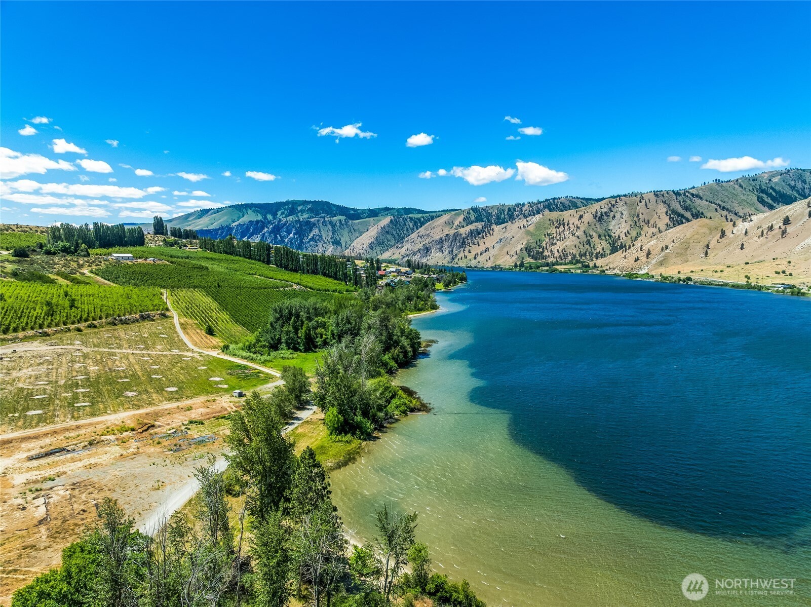 0 Lot 4 Silvest Road Orondo, WA 98843 - Photo 18 of 23 a view of a lake with a yard