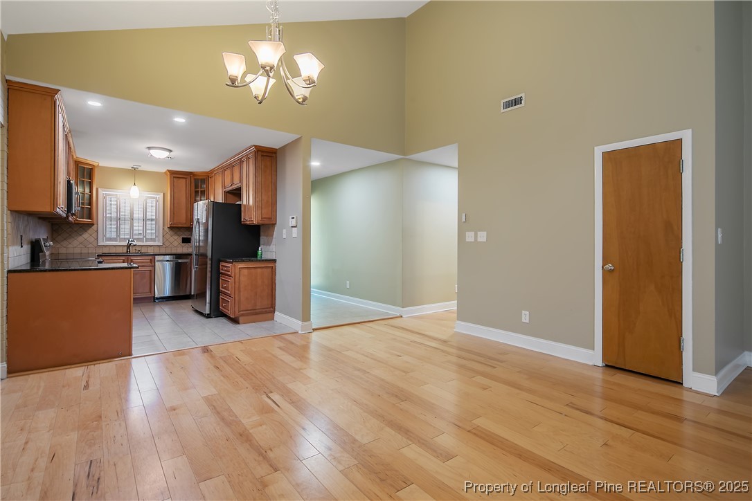 2118 Winterlochen Road Fayetteville, NC 28305 - Photo 11 of 50 a view of a kitchen with a sink and a refrigerator