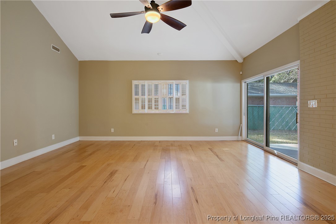 2118 Winterlochen Road Fayetteville, NC 28305 - Photo 20 of 50 a view of an empty room with wooden floor and a window