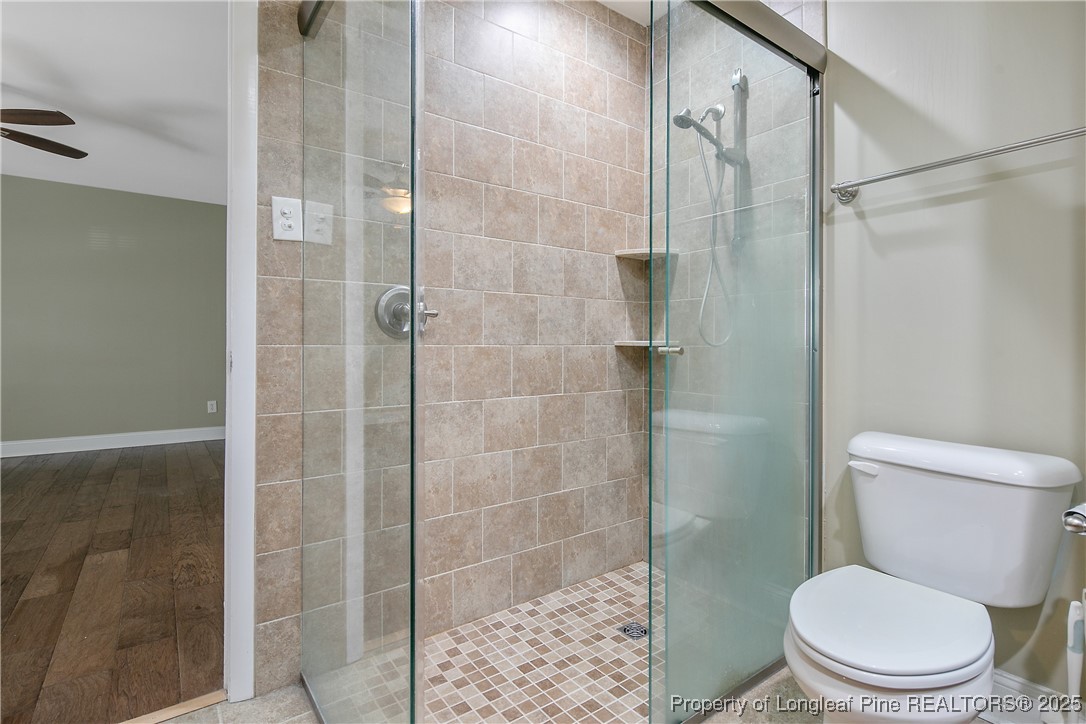 2118 Winterlochen Road Fayetteville, NC 28305 - Photo 32 of 50 a white toilet next to a bathroom