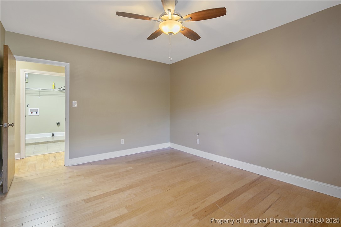 2118 Winterlochen Road Fayetteville, NC 28305 - Photo 38 of 50 an empty room with closet and a chandelier fan