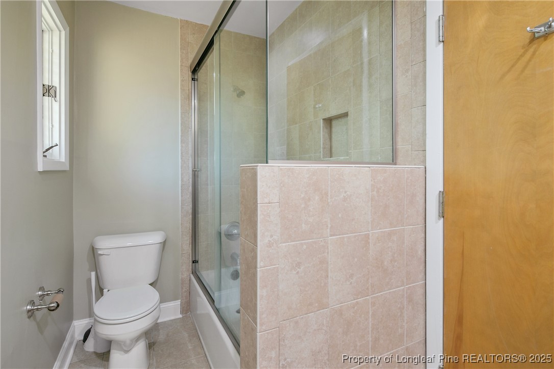 2118 Winterlochen Road Fayetteville, NC 28305 - Photo 42 of 50 a bathroom with a toilet and a shower