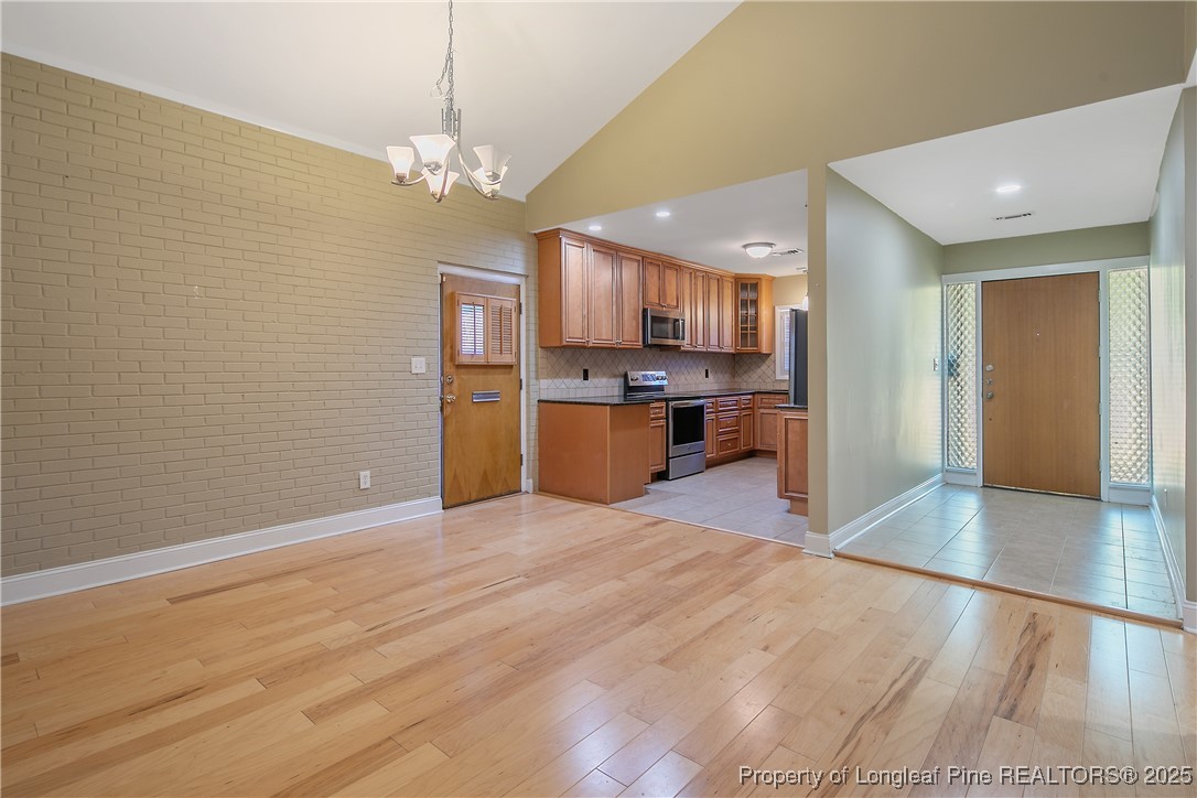 2118 Winterlochen Road Fayetteville, NC 28305 - Photo 9 of 50 a view of a kitchen with a sink and a refrigerator