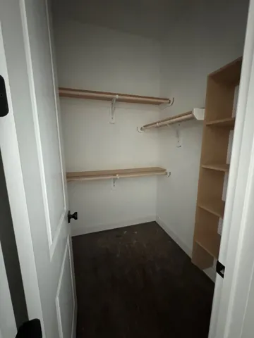 a spacious bathroom with a granite countertop sink a toilet and bathtub