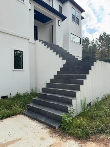 a view of empty room with a fireplace