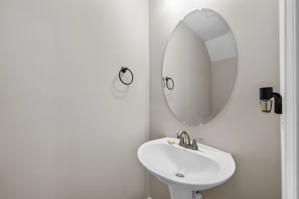 a bathroom with a sink and mirror