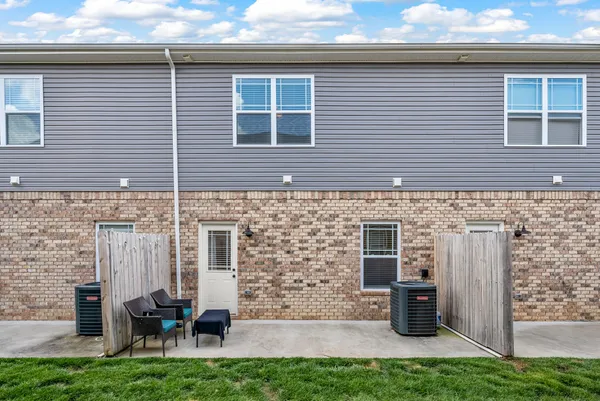 a backyard of a house with seating space