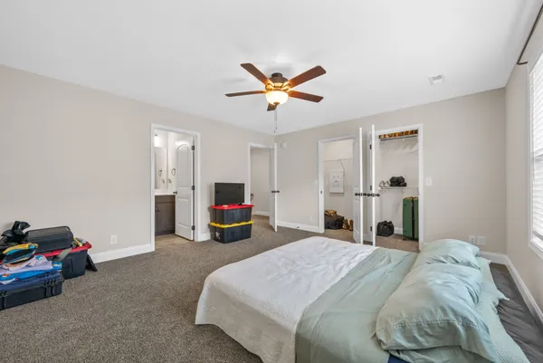 a bed room with a bed and a tv