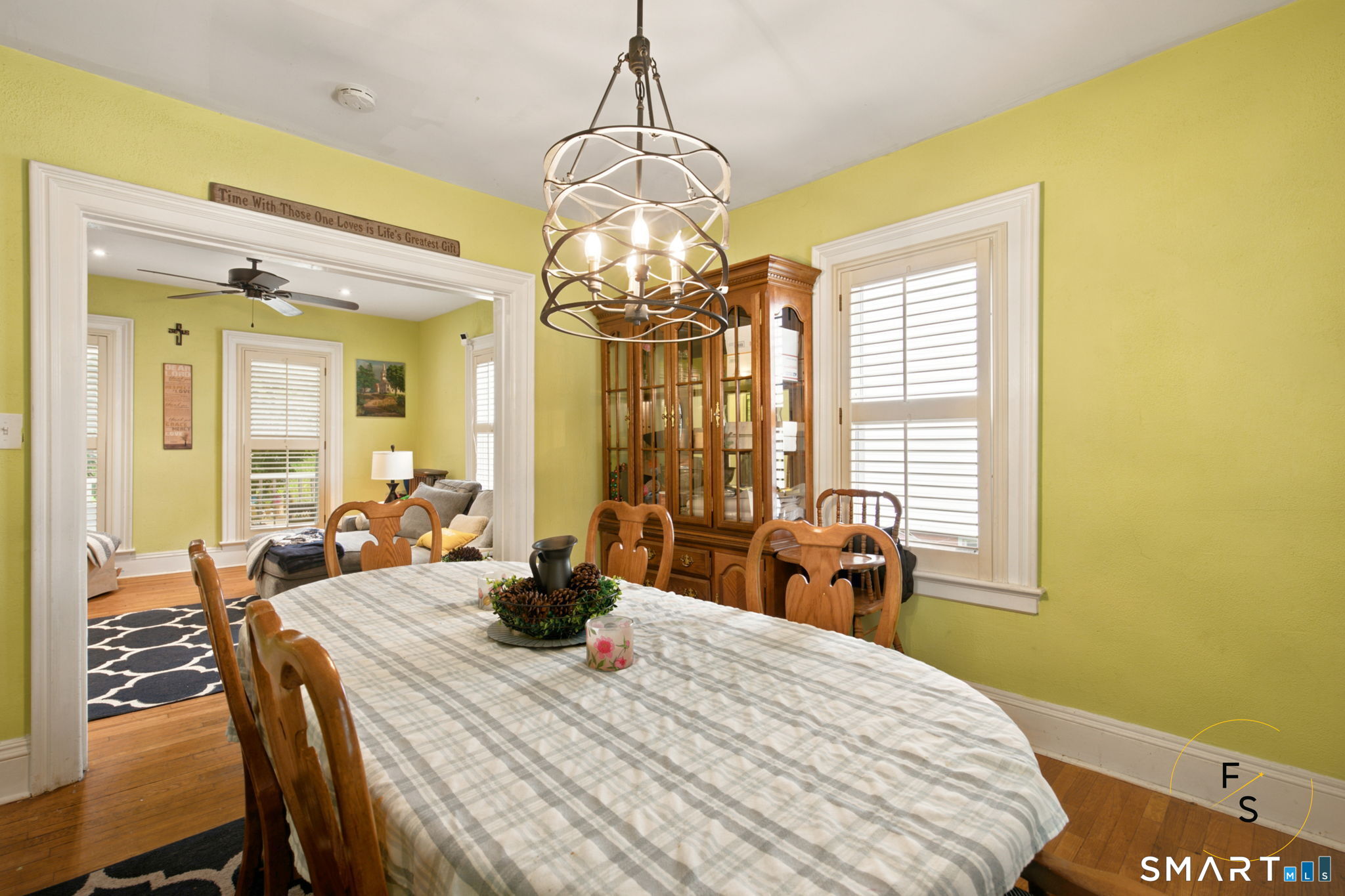 182 Broad Street Norwich, CT 06360 - Photo 10 of 30 a bedroom with a bed a table and chair