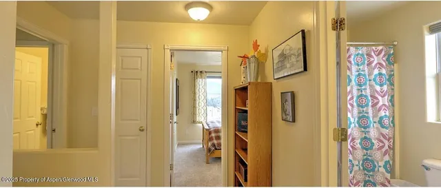 a bathroom with a mirror and a shower