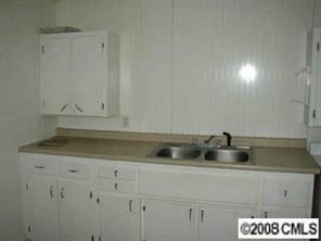 2134 Triplett Road Mount Ulla, NC 28125 - Photo 4 of 8 a kitchen with a sink and cabinets