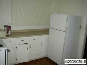 2134 Triplett Road Mount Ulla, NC 28125 - Photo 5 of 8 a white refrigerator freezer sitting inside of a kitchen