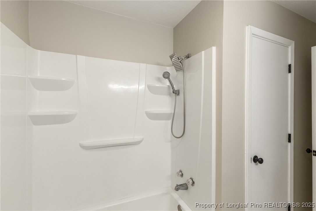 321 Summerhill Road Fayetteville, NC 28303 - Photo 13 of 26 a bathroom with a shower and a shower