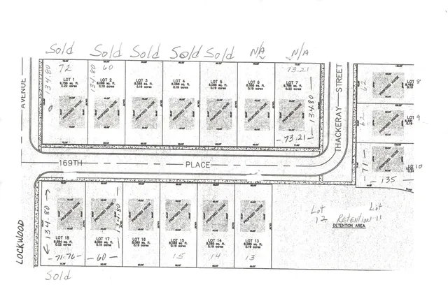 a black white and white photo of a living room