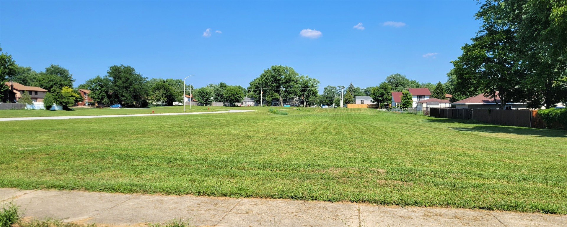 16352 West 169th Place Oak Forest, IL 60452 - Photo 7 of 7 a backyard of a house with lots of green space and outdoor seating