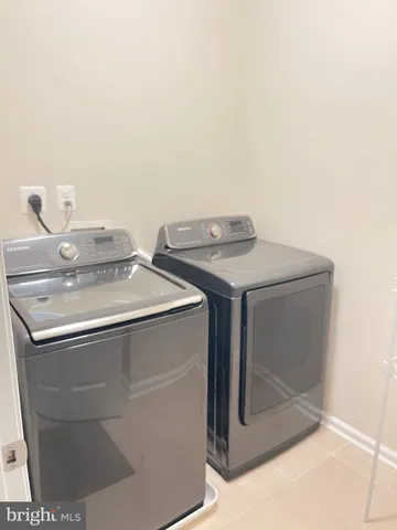 a kitchen with a refrigerator and cabinets
