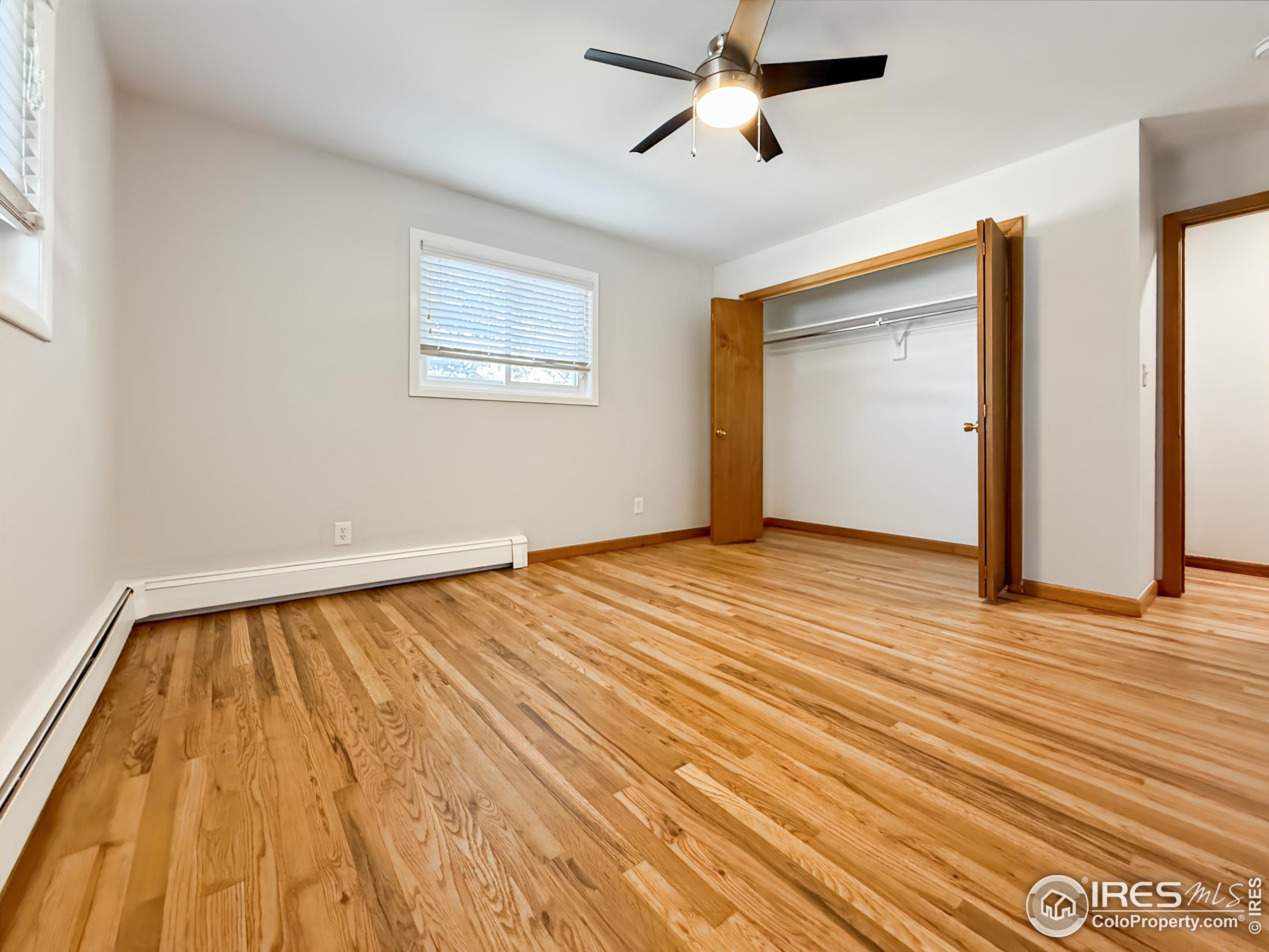 1695 6th Street Limon, CO 80828 - Photo 15 of 32 a view of a room with wooden floor and white walls