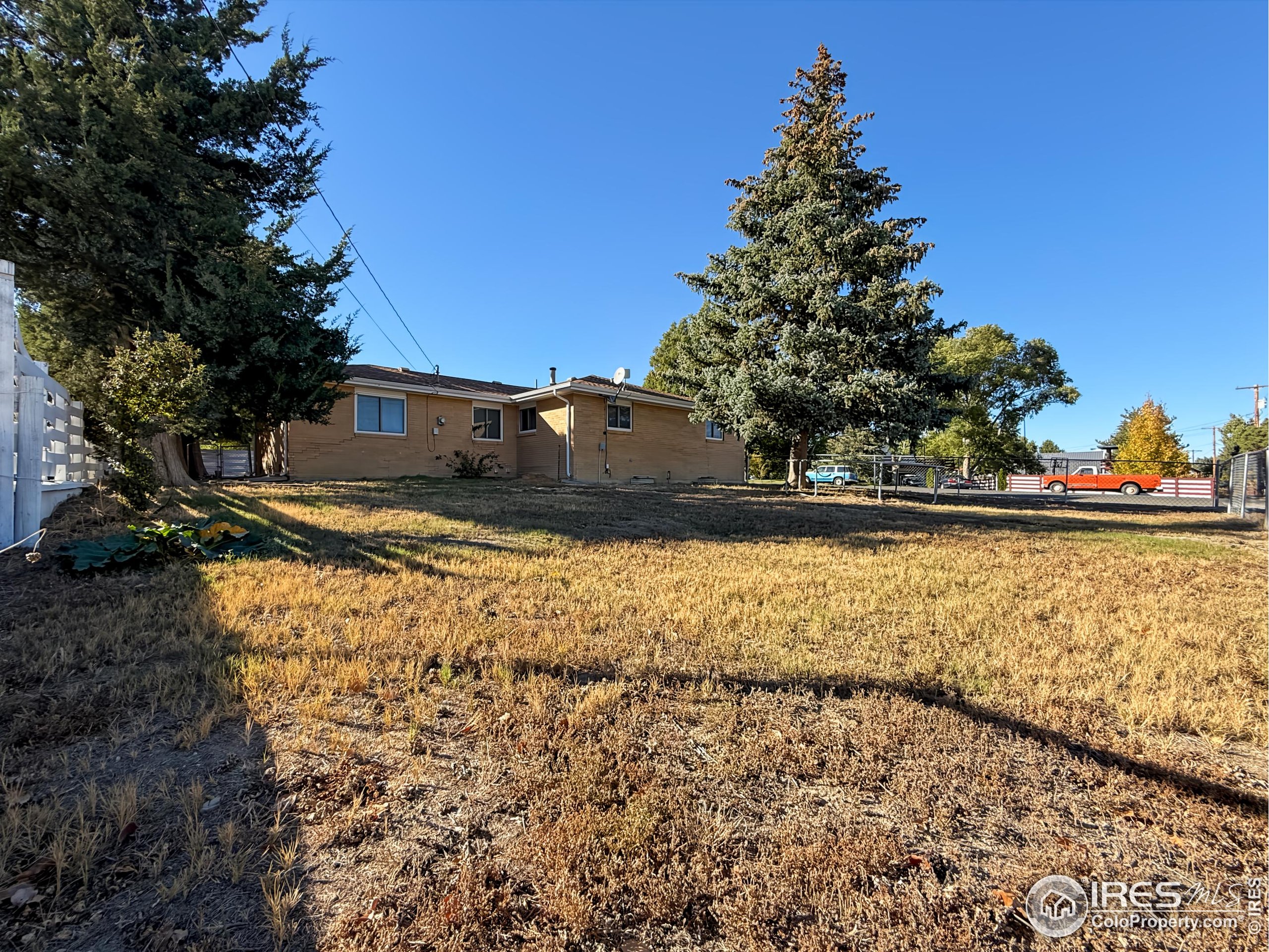 1695 6th Street Limon, CO 80828 - Photo 29 of 32 a view of a yard with an outdoor space