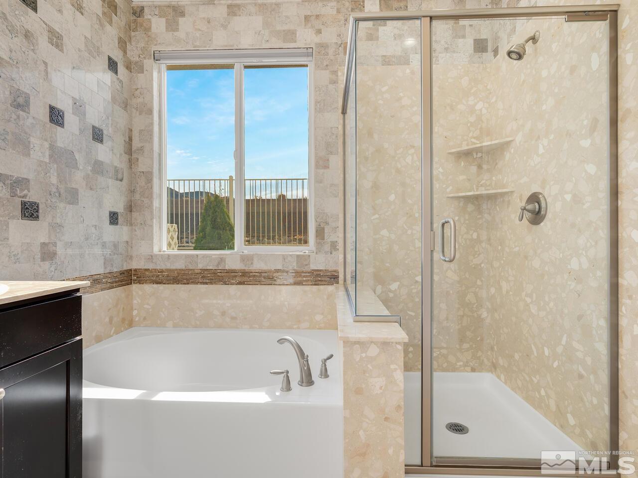 2080 Whitecliff Drive Reno, NV 89521 - Photo 12 of 21 a white bath tub sitting next to a shower